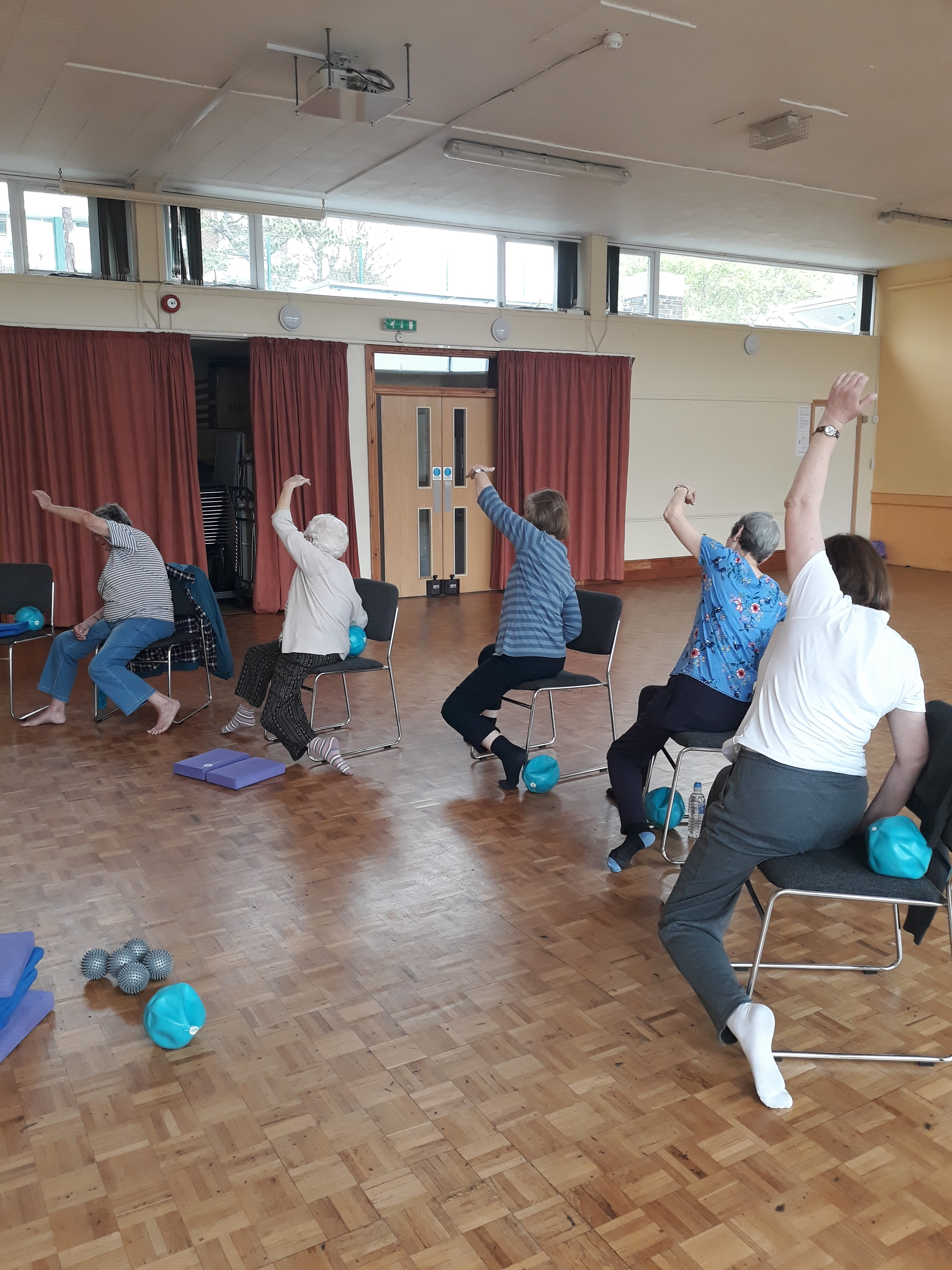 Stretching in the Chair-assisted class.